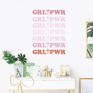 Close-up of GRL PWR wall decal with colorful roses for bedroom interior decoration