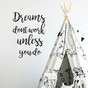 Minimalist white teepee tent with floral print and black quote wall decal in Nordic bedroom