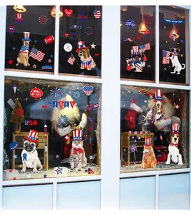 Detailed view of July 4th window clings featuring patriotic pets and US flags on glass