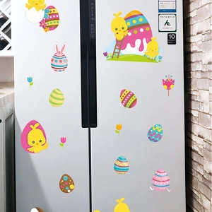 Detailed view of colorful Easter bunny and chick stickers applied on a white refrigerator
