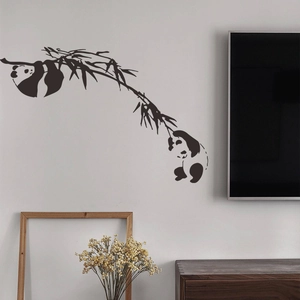 Playful black panda on bamboo branch wall decal for living room and bedroom home decor