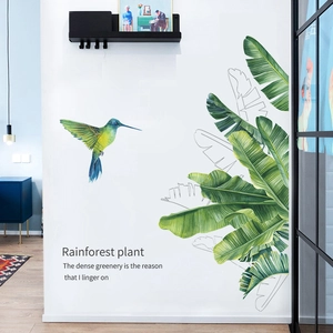Detailed wall sticker featuring hand-painted watercolor hummingbird and tropical green leaves