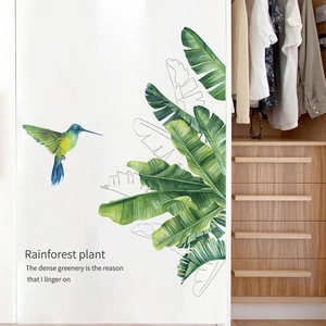 Tropical rainforest wall sticker featuring watercolor banana leaves and a vivid hummingbird