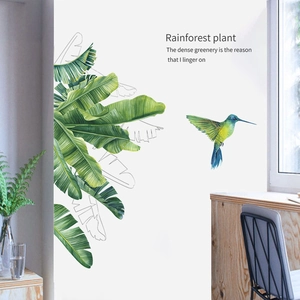 Rainforest wall sticker with tropical green leaves and flying hummingbird in watercolor style