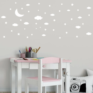 Cloud and moon wall stickers for nursery decor in a soft minimalist bedroom style