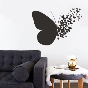 Minimalist black butterfly wall decal set showing large wing dissolving into small butterflies