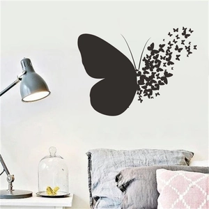 Minimalist black butterfly wall sticker for bedroom featuring large silhouette and small flying decals
