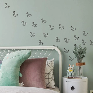 Black geometric origami swan wall stickers for modern bedroom decor and nursery wall art