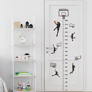 Detail of basketball dunk silhouette height chart with 0-180cm scale on a door