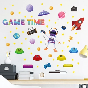 Glow-in-the-dark GAME TIME space astronaut wall decals set on a bedroom wall scene