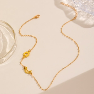 Elegant gold stainless steel moon and sun pendant necklace with adjustable chain