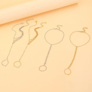Detailed set of bohemian gold and silver slave bracelets with rings and adjustable chains