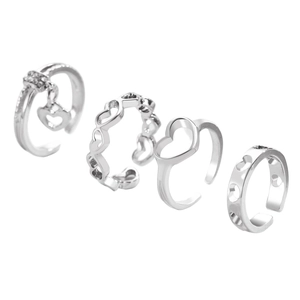Set of four minimalist silver open rings with hollow heart shapes and crystal accents