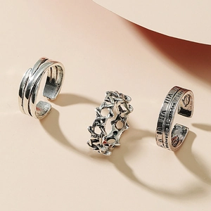 Three-piece antique silver ring set featuring Roman numerals and hollow woven designs