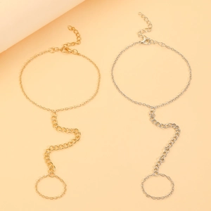 Detailed view of bohemian gold and silver slave bracelets with adjustable ring and lobster clasp