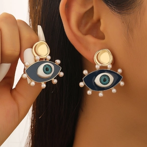Golden evil eye hoop earrings with blue enamel, white pearls and zircon accents