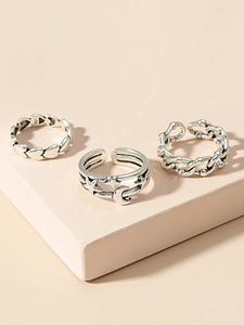 Detailed macro view of S925 silver vintage heart, crescent moon, and chain ring set