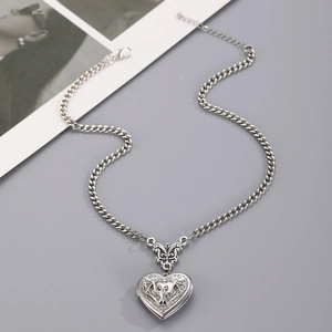 Vintage silver heart locket necklace with gothic bat engraving and thin chain