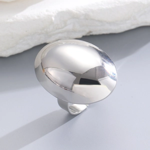 Detailed macro view of the silver metallic minimalist ring with mirror polished surface