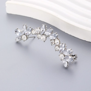 Macro view of silver floral ear crawler with marquise and round cut cubic zirconia stones
