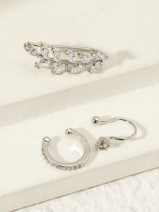 Detailed view of silver flower ear cuff set with micro-inlaid cubic zirconia stones