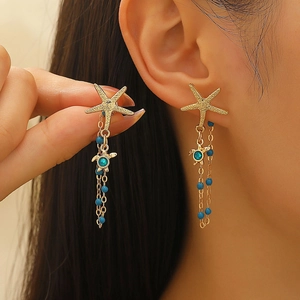 Boucles d'oreilles bohèmes dorées étoile de mer et tortue avec perles bleues pour la plage