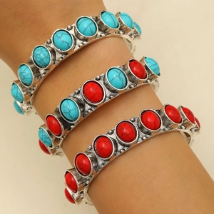 Bohemian style open cuff bracelets with turquoise and coral stones on vintage silver