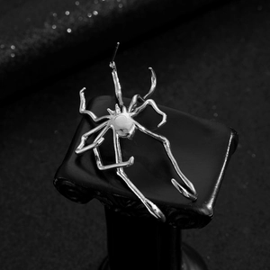 Gothic silver spider ear cuff wrap earring with detailed metal legs on black background