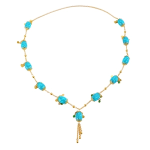 Ethnic style bohemian necklace with turquoise stones and golden tassel pendants