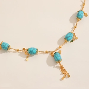 Bohemian gold chain necklace with oval turquoise stones and delicate flower tassels