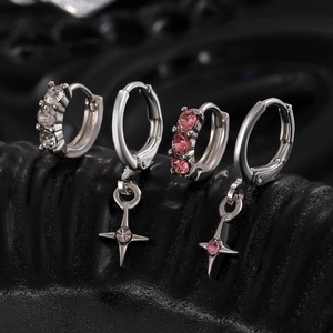 Set of four silver hoop earrings with star pendants and pink white zircon stones