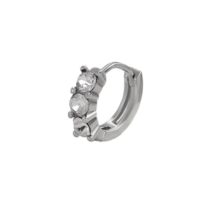 Close-up of silver hoop earring with three vertical clear cubic zirconia stones and hinge clasp