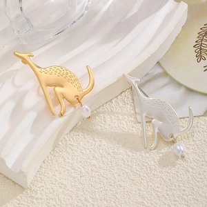 Vintage gold and silver animal brooches with textured finish and elegant pearl drops