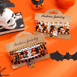 Halloween beaded bracelet set with pumpkin, ghost, and bat charms on display card