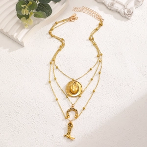 Three-layer gold necklace set featuring cowboy hat, horseshoe, and boot charms on white background