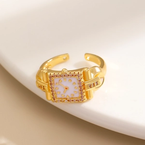 Anello orologio dorato creativo con cristalli rosa su supporto in ceramica bianca