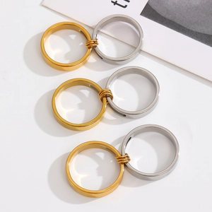 Detailed view of gold and silver double-layer connected stainless steel rings