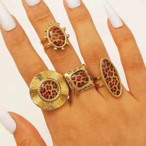 Set of four Bohemian 18K gold-plated leopard print rings in diverse geometric shapes