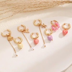 Boho asymmetrical pearl hoop earrings with ceramic hearts and seashell charms