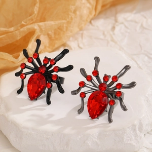 Gothic spider open ring with red teardrop gemstone on a textured white stone base