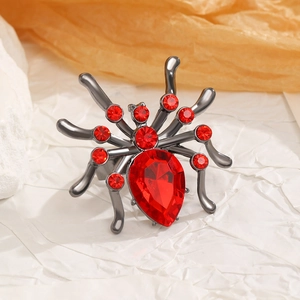 Macro view of gothic spider ring with deep red rhinestones and gunmetal alloy frame