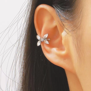 Detailed view of silver butterfly ear cuff with sparkling marquise zircon on ear