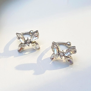 Silver zircon butterfly ear clips for women with elegant insect shape on white background