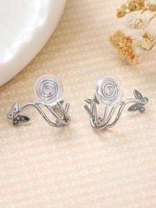 Detail of silver butterfly clip-on earrings with cubic zirconia and soft screw cushions
