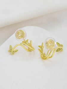 Detailed view of golden butterfly vine ear clips with mosquito coil resin backings