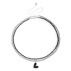 Double-layered silver beaded necklace with black heart pendant and faceted beads