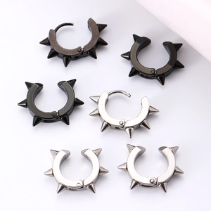 Detail view of punk spike rivet hoop earrings in silver, black and gunmetal steel finish