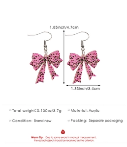 Pink leopard print acrylic bow earrings with dimensions 1.85x1.33 inches and 3.7g weight