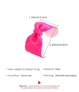 Detail showing dimensions and 15.2g weight of the pink glitter resin bow bracelet