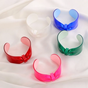 Sparkly resin bow cuff bracelets in vibrant colors with open C-shape design for women